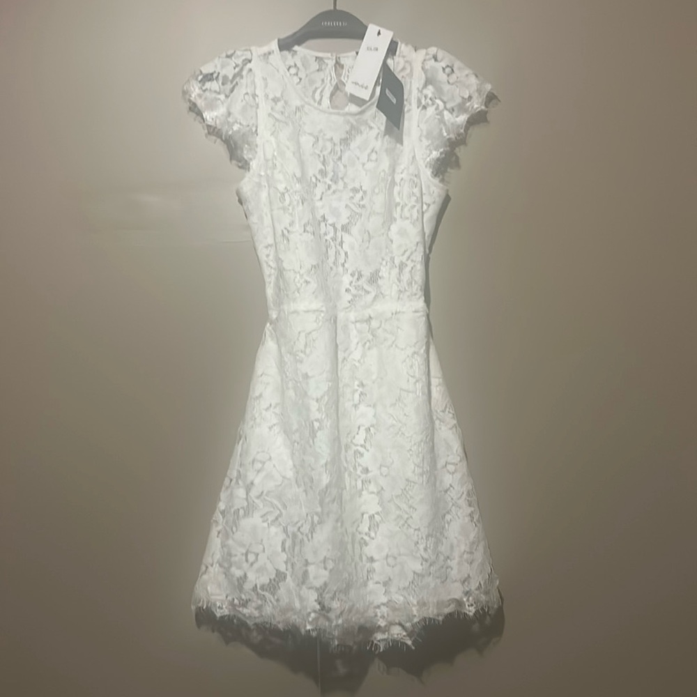 Signature8 Women’s white open back sleeveless mini dress